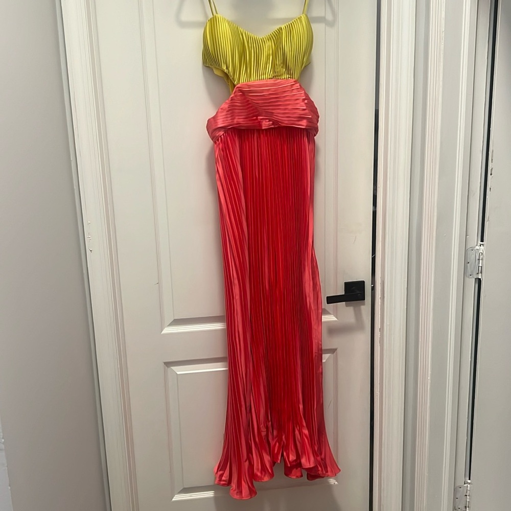 Pleated satin dress with side cutouts and side split.